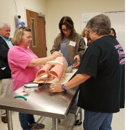 Simulation training with three women working.