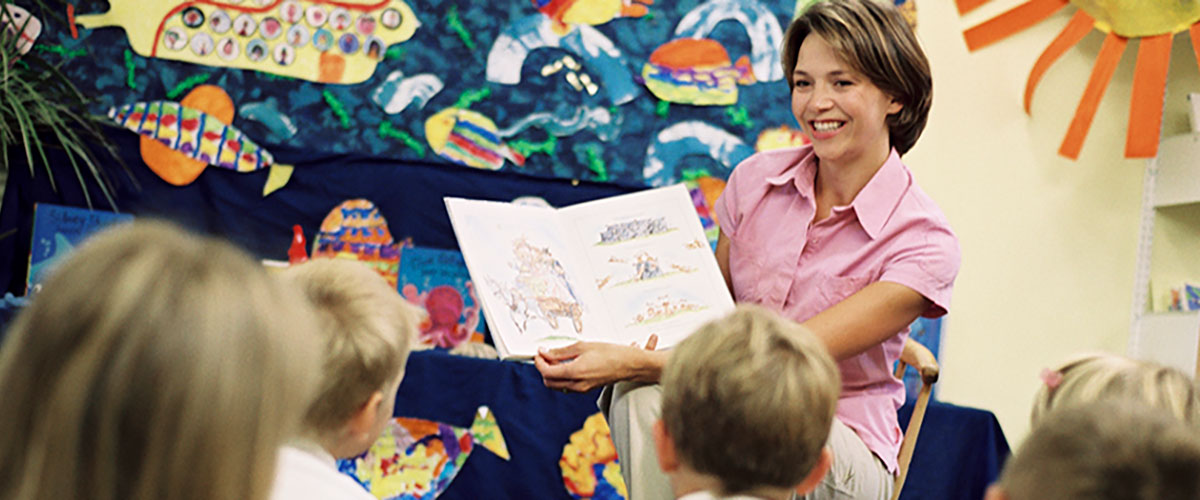 Teacher reading to class.