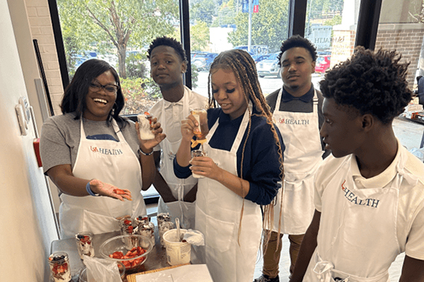 Participants in Project Inspire take a cooking class