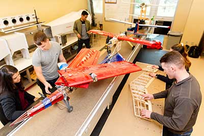 Students working on drone plane.