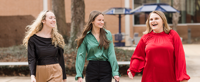 MCOB students walking outside campus.