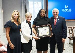 Melissa Whitsett with Dr. Kent, President Jo Bonner, and management team.