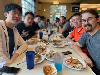 Male students enjoying a meal at the Dining Hall