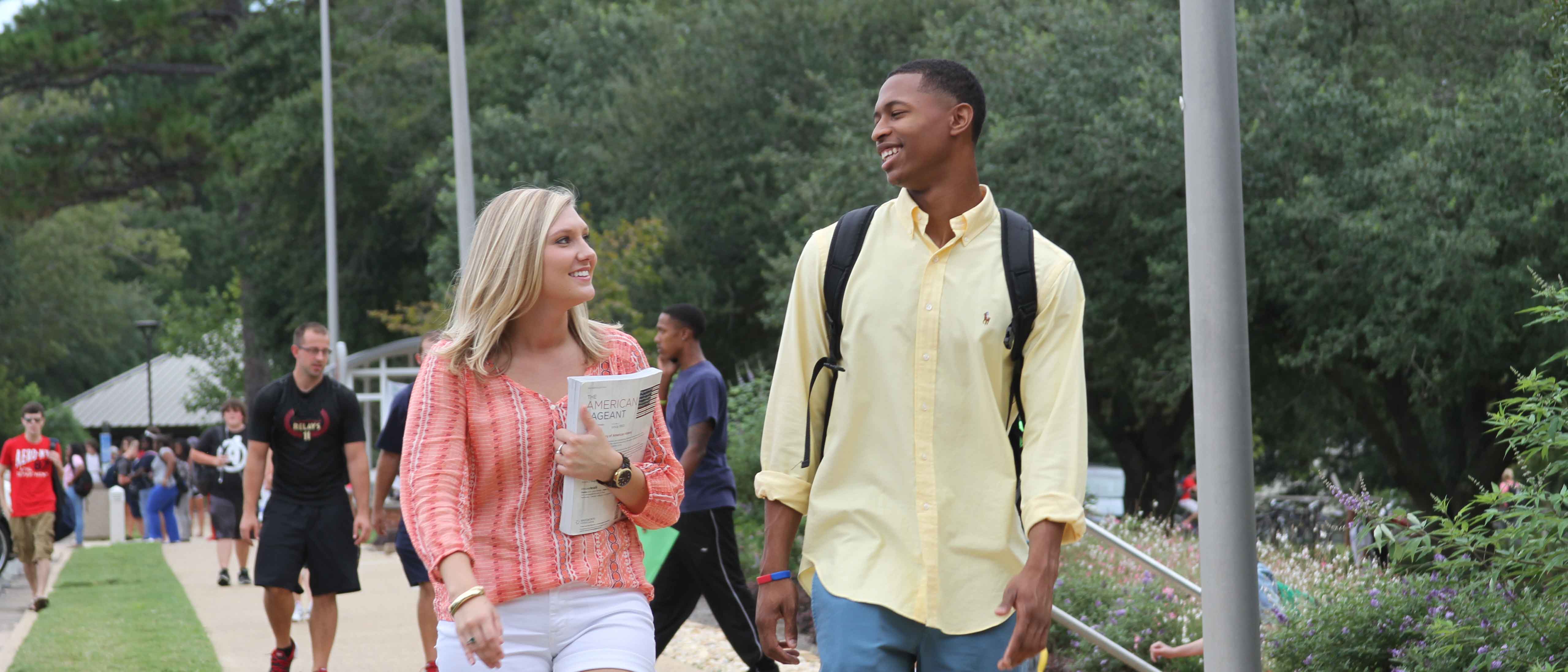 Students walking to class together, talking