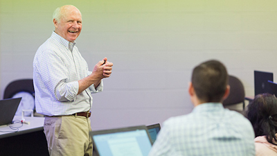 Dr. Hair speaking in class.