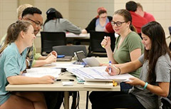 Students talking at table