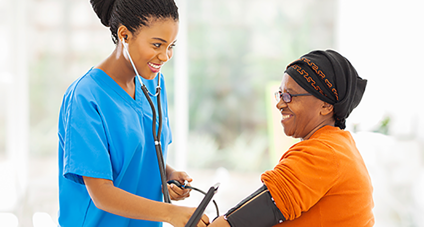 Nurse checking the vitals of a patient.